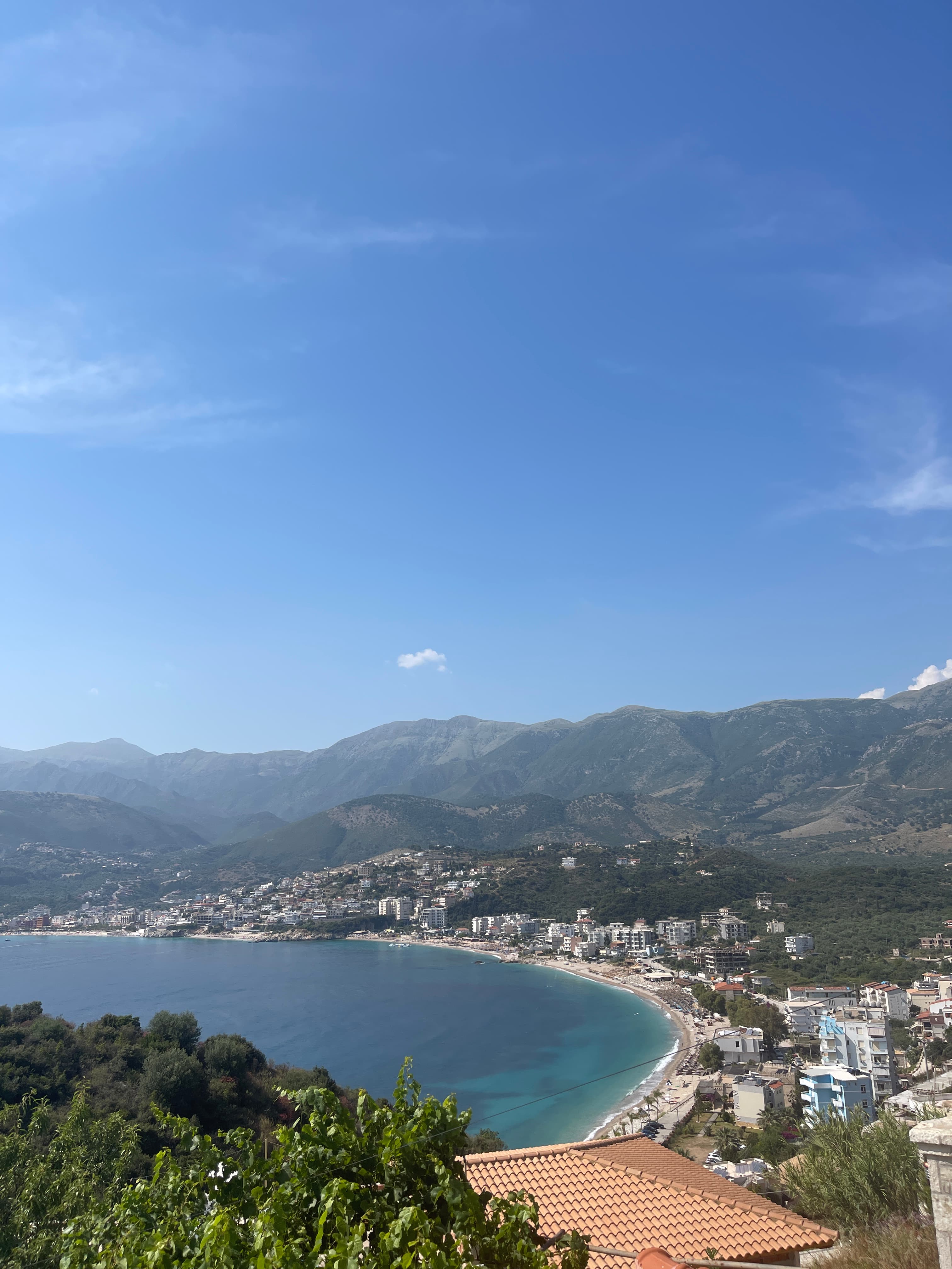 Albanian Riviera — turquoise bay framed by mountains, the south coast.