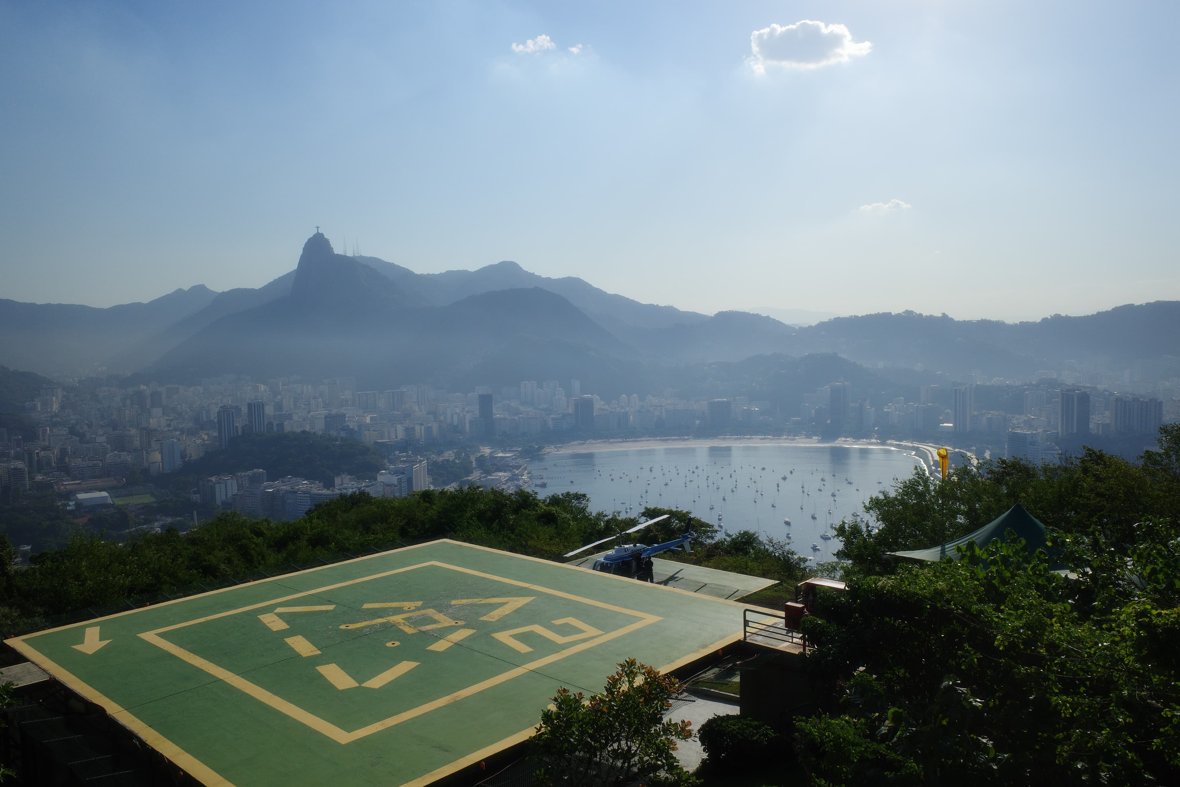 Rio de Janeiro from above — Christ the Redeemer on the ridge, Botafogo bay below.